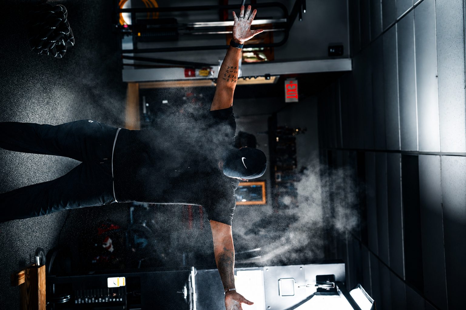 Chalk thrown mid-lift — fitness photography
