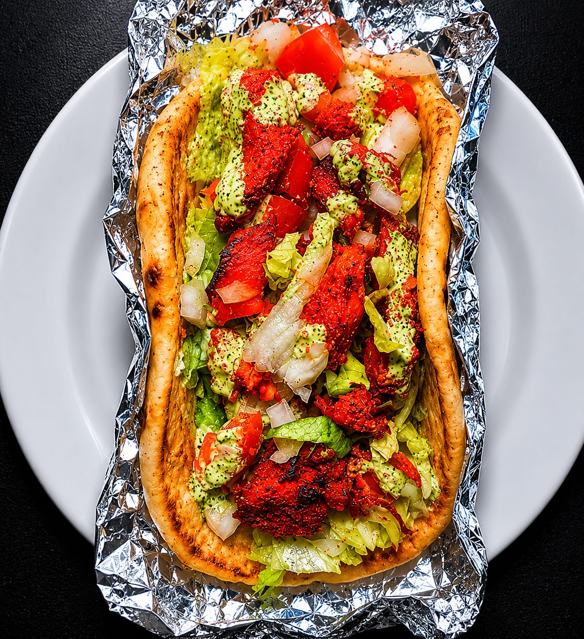 Fresh-baked flatbread with herbs and oil — food photography