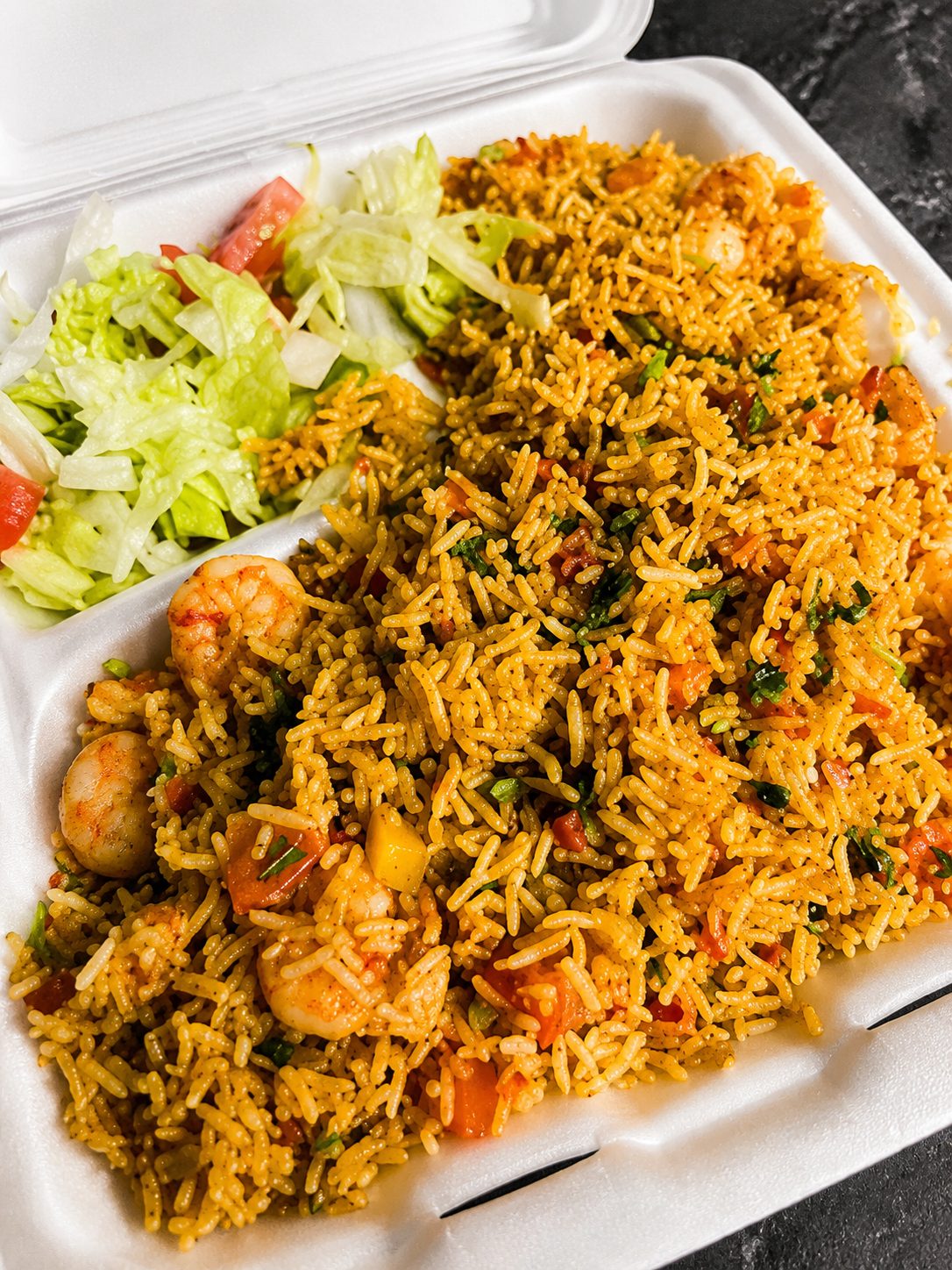 Shrimp biryani plated with rice — food photography