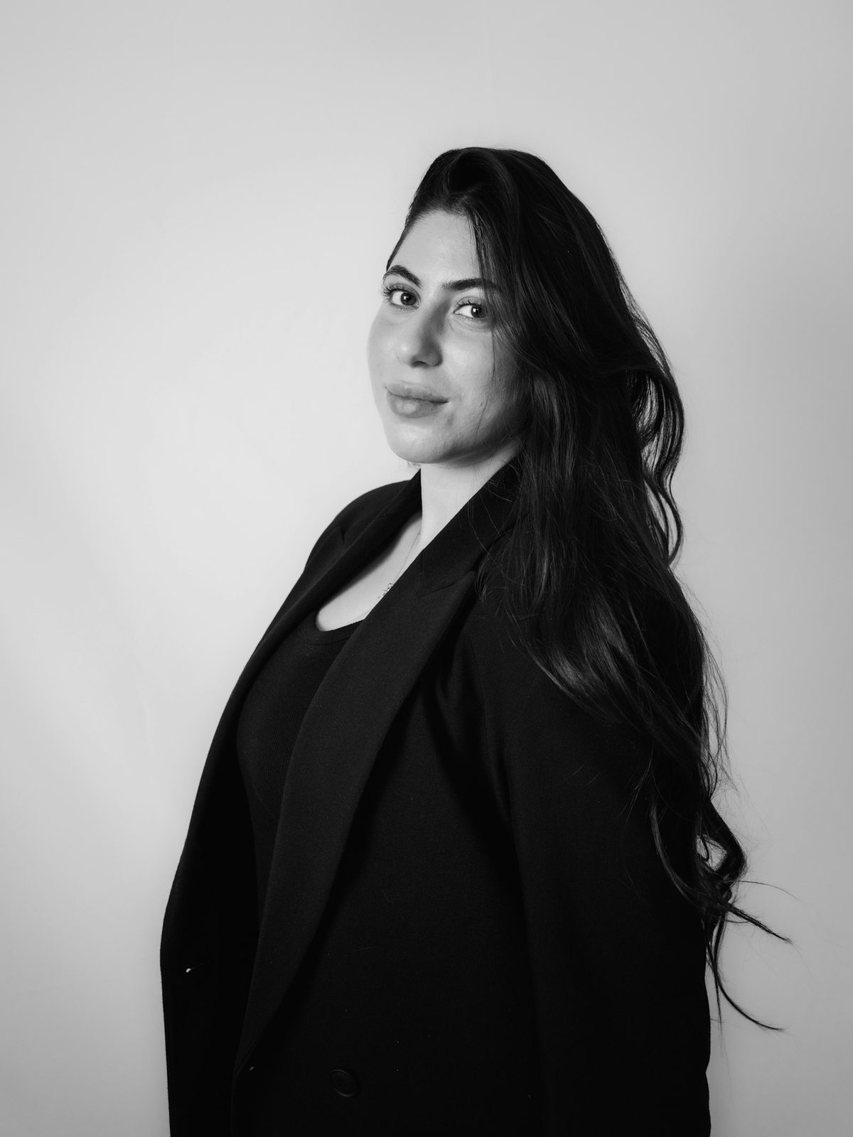 Professional woman in a black blazer — portrait photography